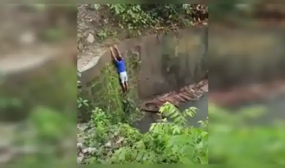 Adolescente pone su vida en peligro para salvar a perro que cayó en un canal de agua [VIDEO]