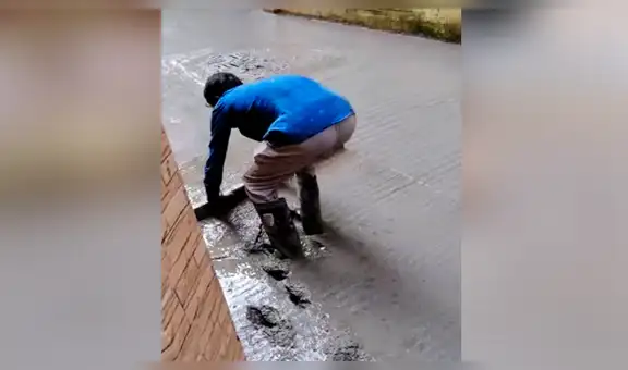 Obreros colocan cemento fresco, sin imaginar que travieso perro terminaría arruinándolo todo [VIDEO]