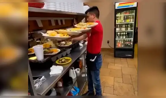 Mesero sorprende con peculiar manera de llevar enormes platos usando solo un brazo [VIDEO]