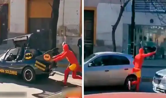 Hombre disfrazado de Chapulín Colorado ayuda a empujar un ‘Batimóvil’ en calle argentina