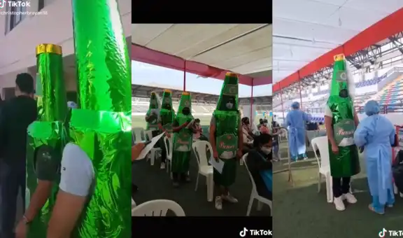 Peruanos asisten a vacunarse contra la COVID-19 vestidos de botellas de cerveza