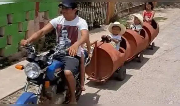 Padre fabrica un ‘tren’ con tres barriles para que sus hijos puedan pasear con él