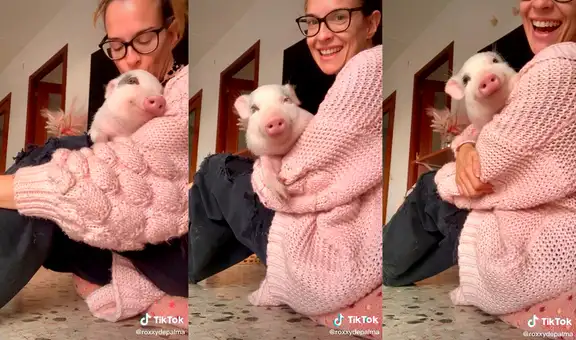 Cerdita no puede ocultar su alegría cuando su querida dueña la carga en sus brazos