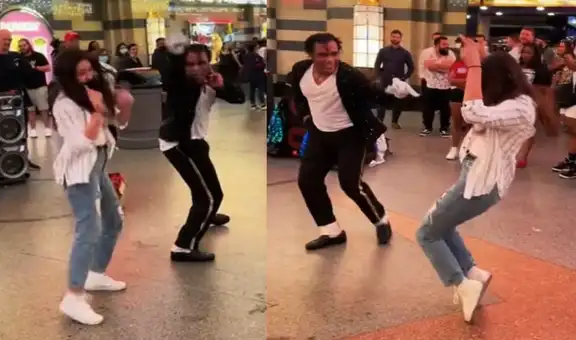 Mujer se roba el show de un artista callejero al realizar impresionantes pasos de baile