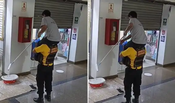 Joven sube a los hombros de vigilante para pintar las paredes de una galería en Gamarra
