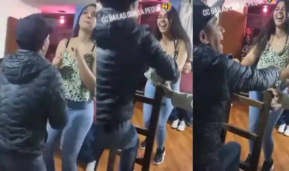 Hombre usa escalera durante una fiesta para bailar con una joven más alta que él