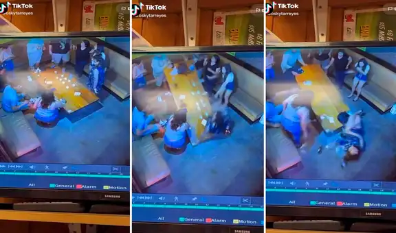 Mujer comete grave error al sentarse en el borde de una mesa y termina empapada de licor 