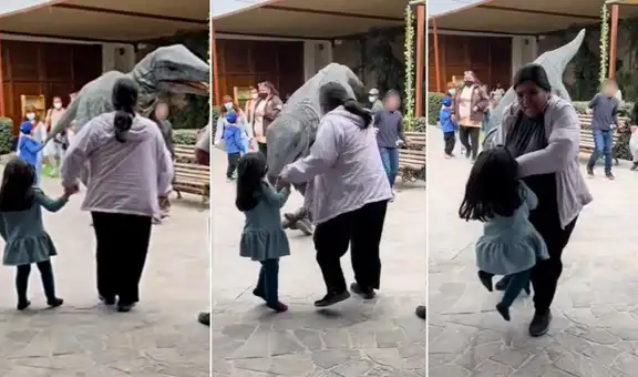 Madre e hija se asustan y tropiezan al ver el disfraz de un dinosaurio en tamaño real