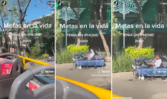 Turistas captan a hombre sin hogar utilizando laptop y celular en un parque