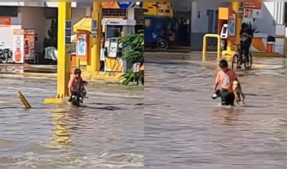 "Son buenos amigos": niño cruza la calle con perrito en brazos tras intensas lluvias en Piura