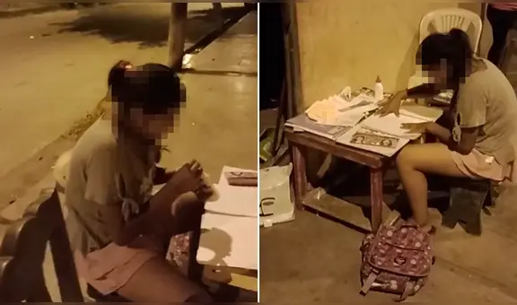 Menor estudia bajo un poste de alumbrado público durante la madrugada en Chimbote