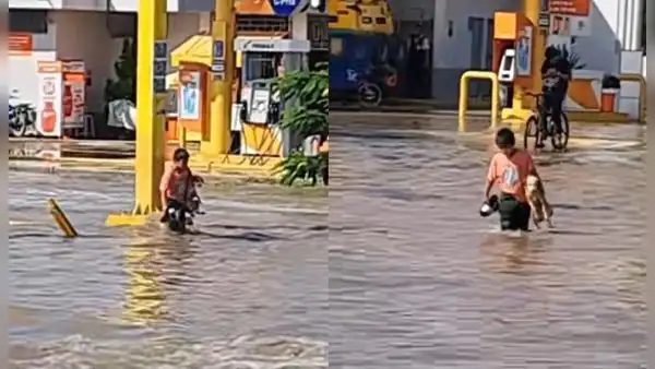 "Son buenos amigos": niño cruza la calle con perrito en brazos tras intensas lluvias en Piura