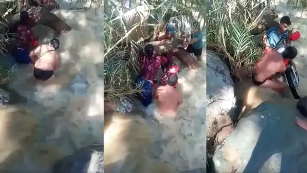 Mujer es rescatada de morir tras intentar cruzar una quebrada en motocicleta