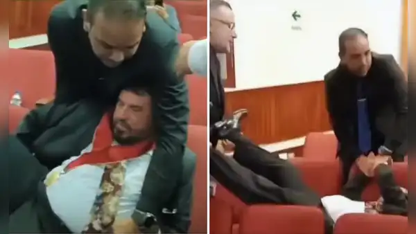 Exdecano del Colegio de Economistas es retirado a la fuerza, cargado de pies y manos, por personal de seguridad durante asamblea