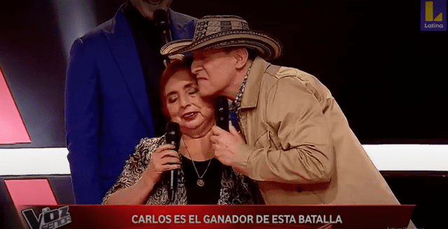 Carlos y Linda se abrazan tras el veredicto del dúo Pimpinela. Foto: captura de Latina
