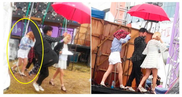 Un miembro del staff de Bol4  sostiene un paraguas sobre Ahn Ji Young mientras Woo Ji Yoonusa su propia chaqueta para cubrirse de la lluvia.