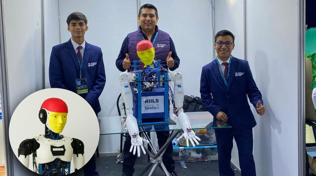 Lisandro Moreno y Javier Alemán al lado de su robot, el cual será presentado en los Emiratos Árabes Unidos. Foto: Escuela de Talentos del Callao   