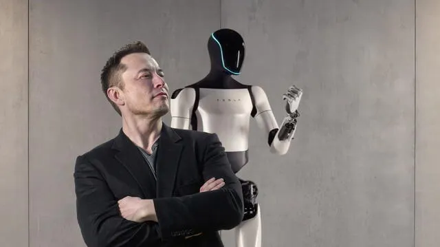 Elon Musk delante de uno de los primeros modelos del robot Optimus Gen 2. Foto: Tesla   