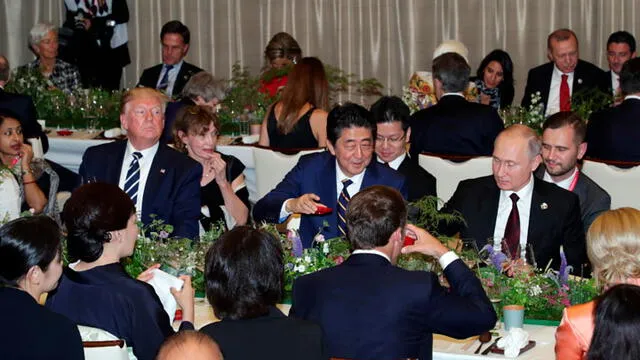 Donald Trump, Vladimir Putin y el primer ministro japonés Shinzo Abe. Foto: EFE.