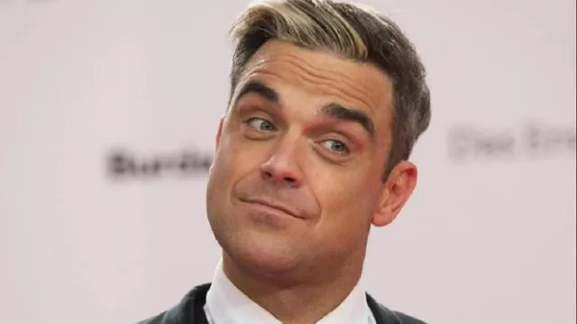 Video muestra a Robbie Williams escapando de gigantesco incendio en Londres