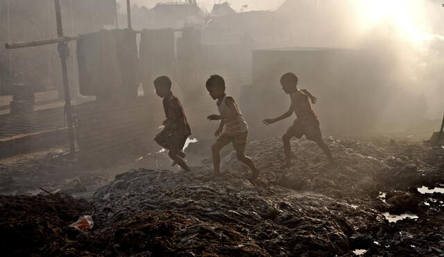 Children play outside their home that has been turned into a large dumpsite by waste from leather industries in Hazaribagh area near Buriganga river in Dhaka.

Most industries based in urban area in Bangladesh pollute environment but leather tanneries probably do the worst damage. Hazaribagh, Dhaka?s leather processing zone, is right in the middle of one of the most densely populated residential area. About 194 leather processing industries operate here and freely dump untreated toxic wastes directly to the low-lying areas, river and natural canals. The pollution is seriously affecting the livelihood thousands of people, bringing it to brink of an environmental disaster


