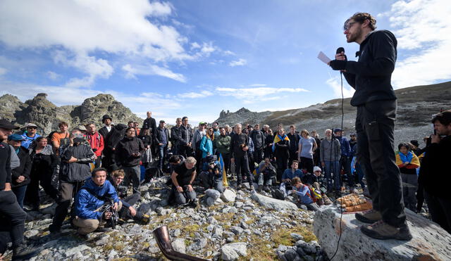 People take part in a ceremony to mark the 'death' of the Pizol glacier (Pizolgletscher) on September 22, 2019 above Mels, eastern Switzerland. - In a study earlier this year, researchers of ETH technical university in Zurich determined that more than 90 percent of Alpine glaciers will disappear by 2100 if greenhouse gas emissions are left unchecked. (Photo by Fabrice COFFRINI / AFP)