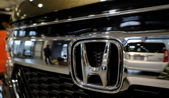 The emblem of Japan's Honda Motor Co. is displayed on one of the company's latest cars at a showroom in Tokyo on February 2, 2018. - Honda was expected to announce the company's nine-month earnings report later in the day on February 2. (Photo by Kazuhiro NOGI / AFP)