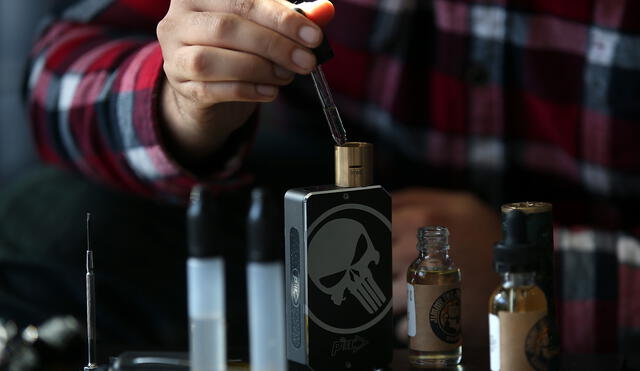 SAN RAFAEL, CA - JANUARY 28: A customer fills a vaporizer, or E-Cigarette, with oil at Digital Ciggz on January 28, 2015 in San Rafael, California. The California Department of Public Health released a report today that calls E-Cigarettes a health threat and suggests that they should be regulated like regular cigarettes and tobacco products.   Justin Sullivan/Getty Images/AFP