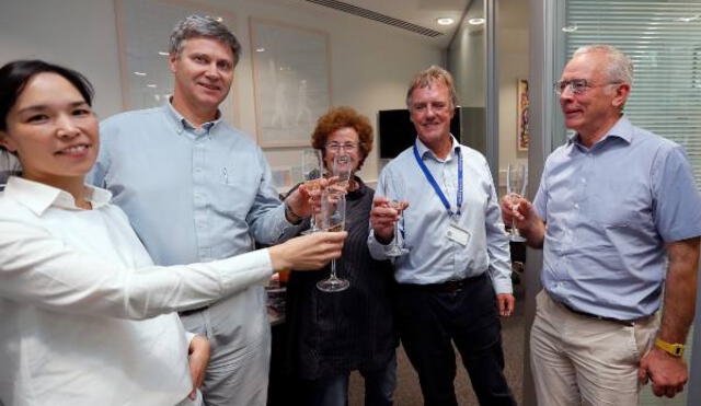 Scientist Peter J.Ratcliffe, second from right, celebrates with his team at the University in Oxford, England, Monday, Oct. 7, 2019. Peter J.Ratcliffe and William G.Kaelin and Gregg L.Semenza have been awarded the Nobel Prize for Medicine for their discoveries of 'how cells sense and adapt to oxygen availability'.(AP Photo/Frank Augstein)