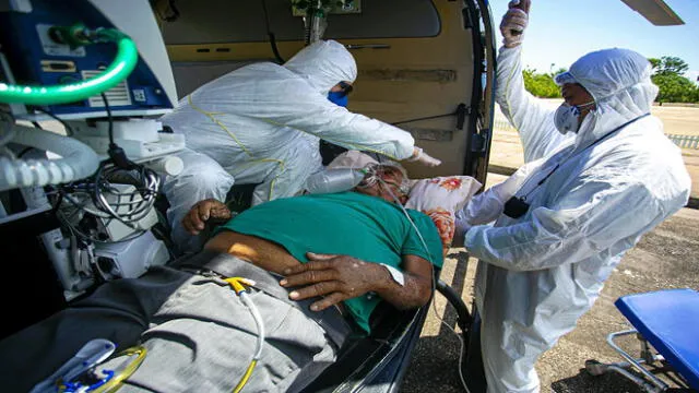 A 77-year-old COVID-19 positive patient is transferred by helicopter from the municipality of Monte Alegre to the municipality of Santarem in the Brazilian state of Para, on July 15, 2020 to receive treatment amid the novel coronavirus pandemic. (Photo by TARSO SARRAF / AFP)