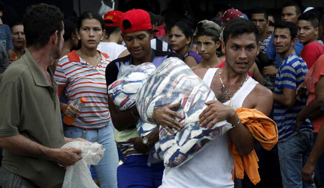 Cuatro muertos tras protestas por comida y saqueos en Venezuela