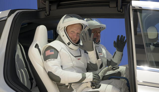 This handout photo released by NASA shows NASA astronauts Douglas Hurley, left, and Robert Behnken, wearing SpaceX spacesuits, are seen as they depart the Neil A. Armstrong Operations and Checkout Building for Launch Complex 39A during a dress rehearsal prior to the Demo-2 mission launch, Saturday, May 23, 2020, at NASA�s Kennedy Space Center in Florida. - NASA�s SpaceX Demo-2 mission is the first launch with astronauts of the SpaceX Crew Dragon spacecraft and Falcon 9 rocket to the International Space Station as part of the agency�s Commercial Crew Program. launch, Saturday, May 23, 2020, at NASA�s Kennedy Space Center in Florida. NASA�s SpaceX Demo-2 mission is the first launch with astronauts of the SpaceX Crew Dragon spacecraft and Falcon 9 rocket to the International Space Station as part of the agency�s Commercial Crew Program. The test flight serves as an end-to-end demonstration of SpaceX�s crew transportation system. Behnken and Hurley are scheduled to launch at 4:33 p.m. EDT on Wednesday, May 27, from Launch Complex 39A at the Kennedy Space Center. A new era of human spaceflight is set to begin as American astronauts once again launch on an American rocket from American soil to low-Earth orbit for the first time since the conclusion of the Space Shuttle Program in 2011. (Photo by Bill INGALLS / NASA / AFP) / RESTRICTED TO EDITORIAL USE - MANDATORY CREDIT "AFP PHOTO /NASA/Bill Ingalls  " - NO MARKETING - NO ADVERTISING CAMPAIGNS - DISTRIBUTED AS A SERVICE TO CLIENTS