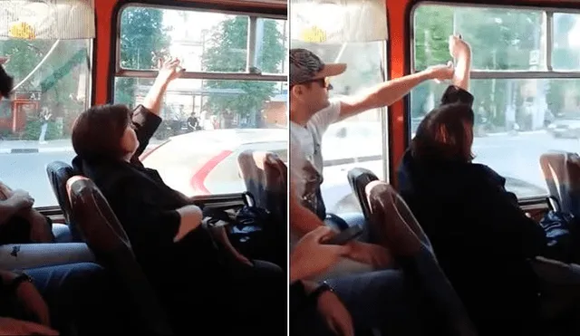 Insólita lucha de dos pasajeros por ventana en bus roba risas en la red [VIDEO]