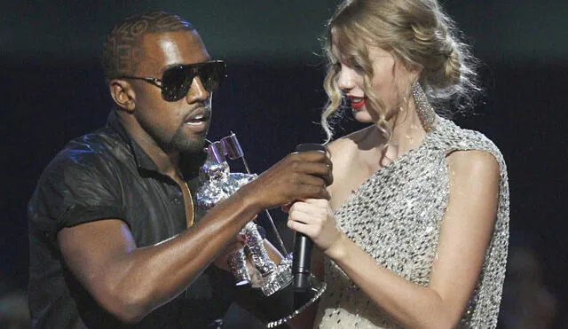 Singer Kanye West takes the microphone from singer Taylor Swift as she accepts the "Best Female Video" award during the MTV Video Music Awards on Sunday, Sept. 13, 2009 in New York.  (AP Photo/Jason DeCrow)