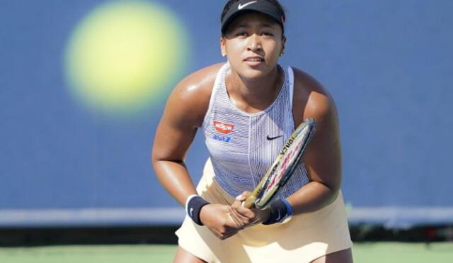 Naomi Osaka, of Japan, prepares to receive a serve from Hsieh Su-Wei of Chinese Taipei,  during the quarterfinals of the Western & Southern Open tennis tournament, Thursday, Aug. 15, 2019, in Mason, Ohio. (AP Photo/John Minchillo)