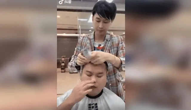 Video es viral en Facebook. El joven comenzó a sentir alergia de sus propios cabellos y estornudó fuertemente, sin sospechar las terribles consecuencias. Foto: Captura.