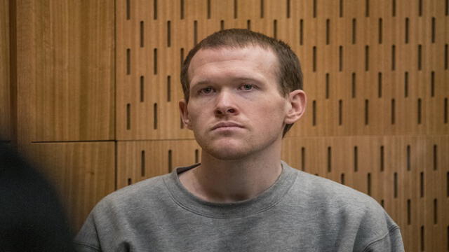 Australian white supremacist Brenton Tarrant listens as Crown prosecutor Mark Zarifeh delivers his submission in court in Christchurch on August 27, 2020. - New Zealand mosque gunman Brenton Tarrant was sentenced to life in prison without parole on August 27 for the massacre of 51 Muslim worshippers, with a judge calling him "wicked" and "inhuman". (Photo by JOHN KIRK-ANDERSON / POOL / AFP)