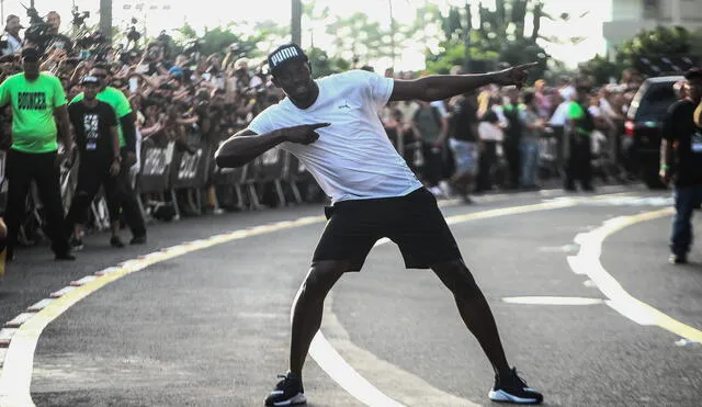 Usain Bolt impresionó en Lima al competir con una mototaxi [FOTOS]