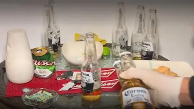 Policías incautaron el licor que estaba distribuido en varios ambientes de la casa. (Foto: Captura de video / América Noticias)