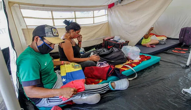 Migrantes venezolanos en carpas instaladas en Colombia mientras esperan la oportunidad de poder regresar a Venezuela, en medio de la pandemia del coronavirus. Foto: AFP