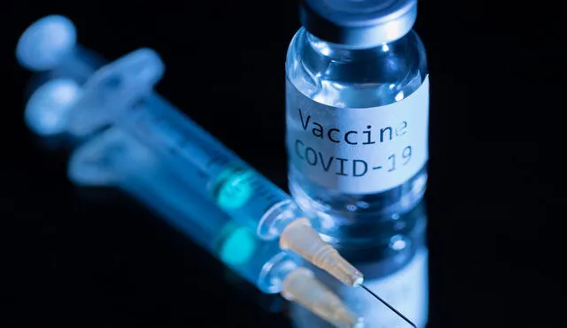 This picture taken on November 17, 2020 shows a syringe and a bottle reading "Vaccine Covid-19". - According to the World Health Organization, some 42 "candidate vaccines" against the novel coronavirus Covid-19 are undergoing clinical trials on November 17, 2020. (Photo by JOEL SAGET / AFP)