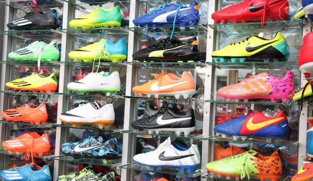 Football shoes of renowned brands (Nike) sold at sports shop in Pattaya market.
