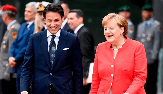 Giussepe Conte, primer ministro de Italia, y Angela Merkel, canciller alemana, durante la cumbre de migrantes de 2018. (Foto: The Times)
