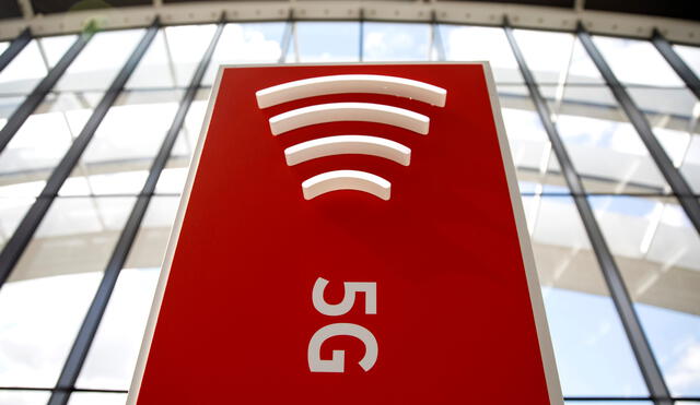 The 5G logo is pictured on a during the launch of Vodafone UK's 5G mobile data network in London on July 3, 2019. (Photo by Tolga Akmen / AFP)