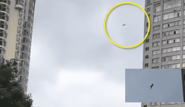 YouTube: "Hombre araña chino" intenta escapar por cable telefónico [VIDEO]