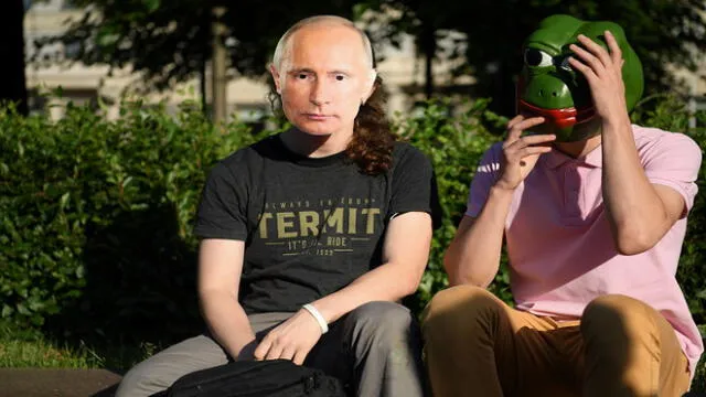 A person wearing a mask depicting Russian President Vladimir Putin along with the  others gathers on Pushkinskaya Square to protest against amendments to the Constitution of Russia in downtown Moscow on July 1, 2020, as Russians vote in the final day of a ballot on constitutional reforms allowing President Putin to potentially stay in power until 2036. (Photo by Kirill KUDRYAVTSEV / AFP)