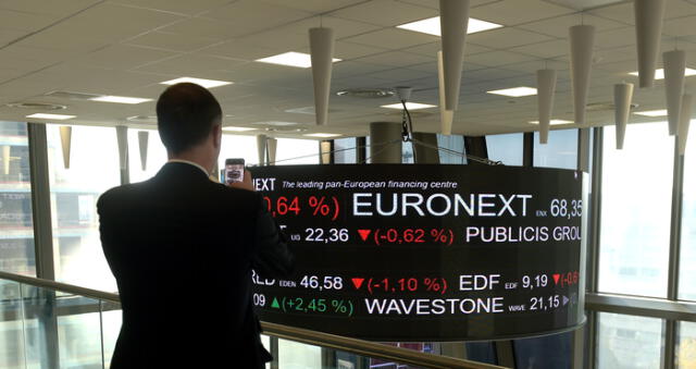The stock tickers and financial display are pictured at the headquarters of the Pan-European stock exchange Euronext in La Defense district, near Paris on November 21,2019 (Photo by ERIC PIERMONT / AFP)