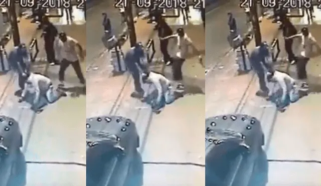 Dan brutal paliza a vendedor y lo arrojan a las llantas de un bus en movimiento [VIDEO]