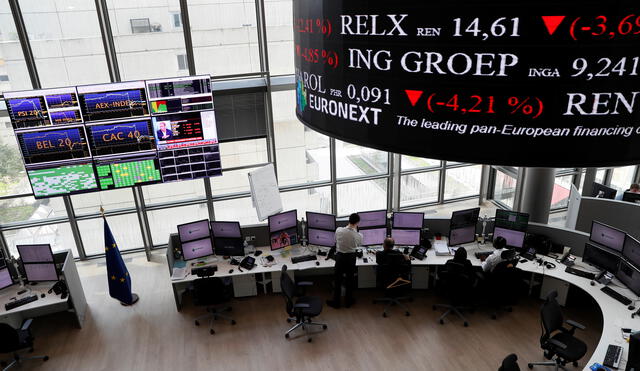 People work as screens display news and trading rates at the Euronext Stock Exchange services in Paris' financial district of La Defense on June 24, 2016 as Britain votes to leave the European Union, fuelling a wave of global uncertainty. (Photo by Thomas SAMSON / AFP) / �The erroneous mention[s] appearing in the metadata of this photo by Thomas SAMSON has been modified in AFP systems in the following manner: [as Britain votes to leave the European Union, fuelling a wave of global uncertainty.] instead of [as Paris stocks surged in early trading today, with the key CAC-40 index gaining over three percent after polls suggested the Remain camp was ahead in the upcoming British referendum on EU membership. ]. Please immediately remove the erroneous mention[s] from all your online services and delete it (them) from your servers. If you have been authorized by AFP to distribute it (them) to third parties, please ensure that the same actions are carried out by them. Failure to promptly comply with these instructions will entail liability on your part for any continued or post notification usage. Therefore we thank you very much for all your attention and prompt action. We are sorry for the inconvenience this notification may cause and remain at your disposal for any further information you may require.�