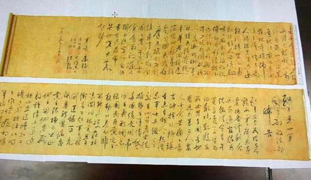 El pergamino ya partido en dos, cuyo contenido era un poema escrito a mano por Mao (1893-1976), siendo el artículo más valioso de todo lo robado. Foto: SCMP